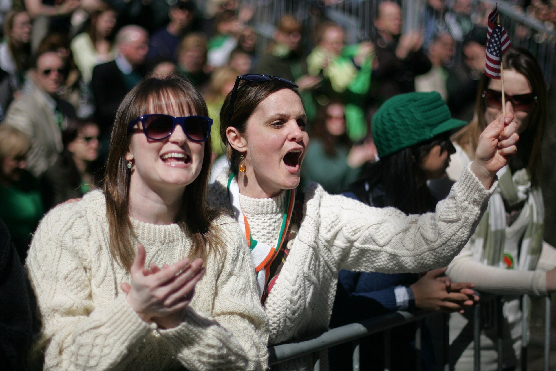 Watching the St Patrick's Day Parade on Fifth Avenue, New York: Aran sweaters, a tricolour scarf and a small Stars and Stripes